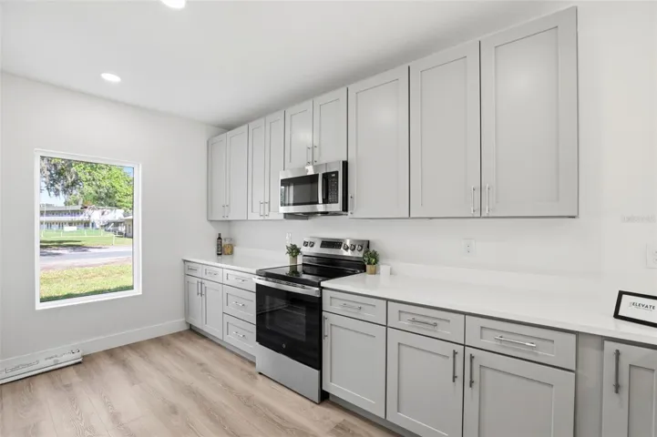 Bright kitchen with stainless steel appliances, modern cabinets, and a practical everyday layout.