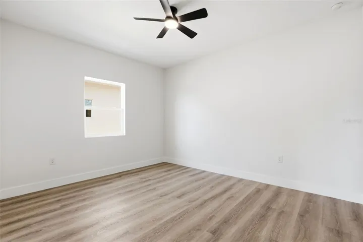 Flexible bedroom space for guests, home office, nursery, or additional storage.