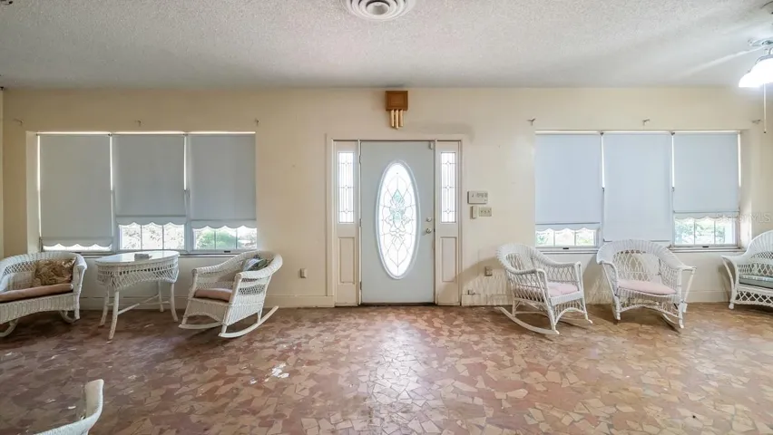 Front enclosed porch with terrazzo flooring