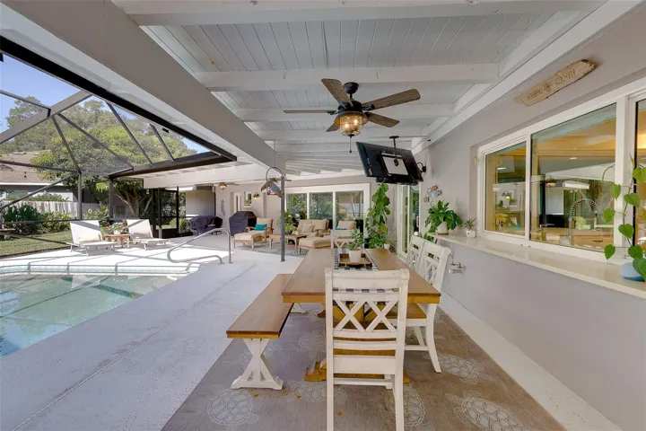 Enclosed porch features 4 ceiling fans