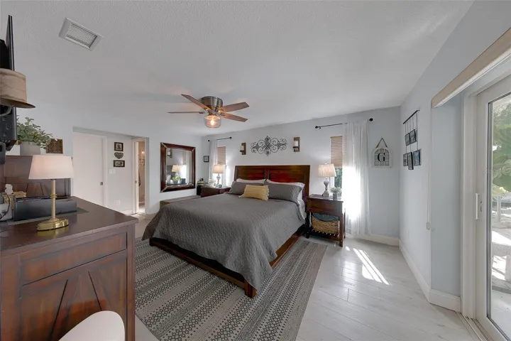 Primary bedroom with walk in closet and a separate linen closet