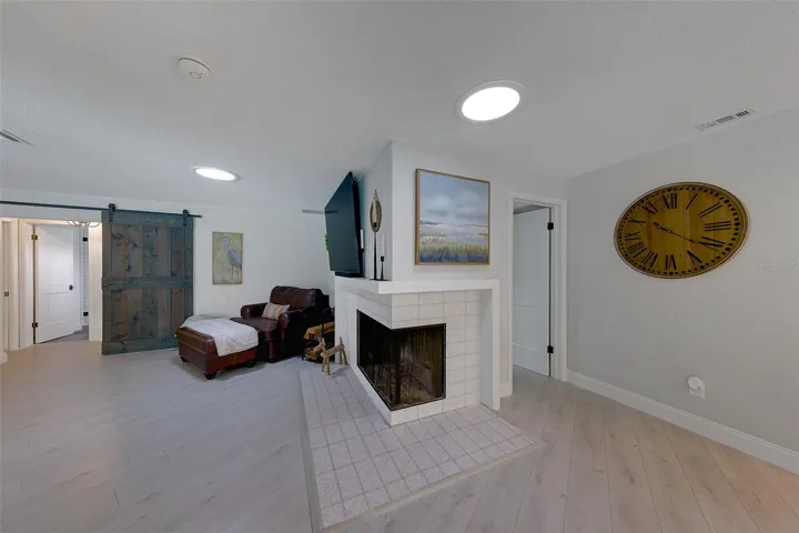 Family room with wood burning fireplace