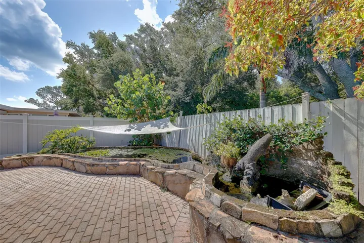 Koi pond with an upper and lower pool with small stream that connects them