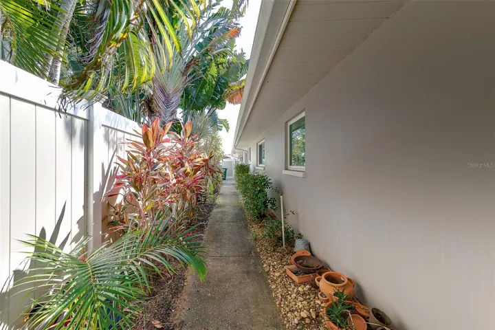 Side yard with walkway to the private entrance