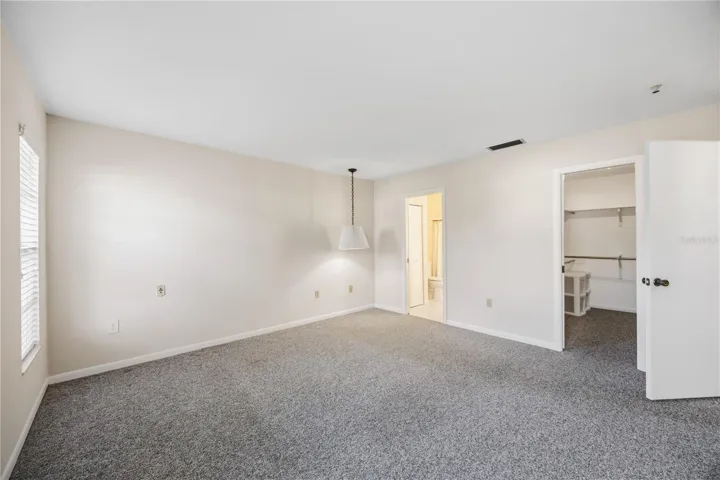 Primary bedroom with walk in closet