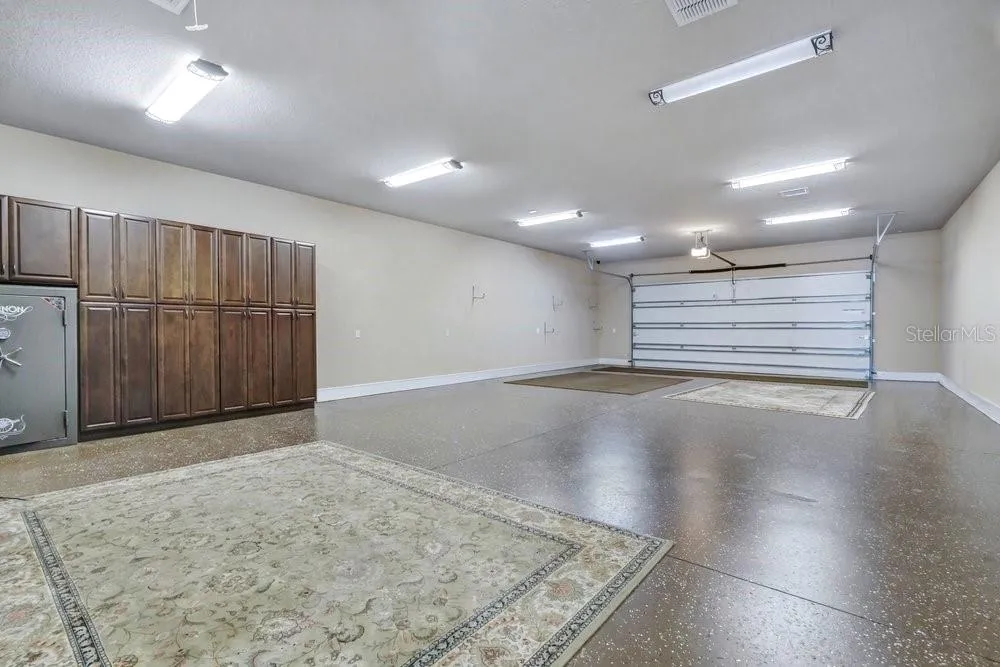 In-Law Suite/Office showcasing 6 car garage with A/C
