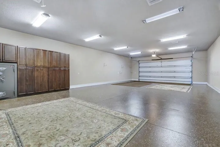 In-Law Suite/Office showcasing 6 car garage with A/C