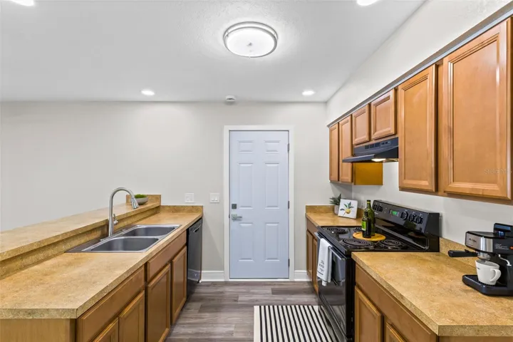 Kitchen with Breakfast Bar and  Double Stainless Sink