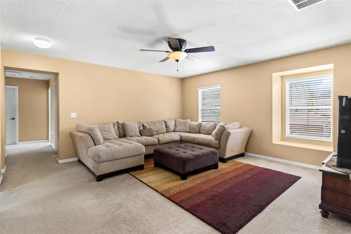 Loft/Bonus room upstairs is perfect as a play room, home gym, office, or media room.