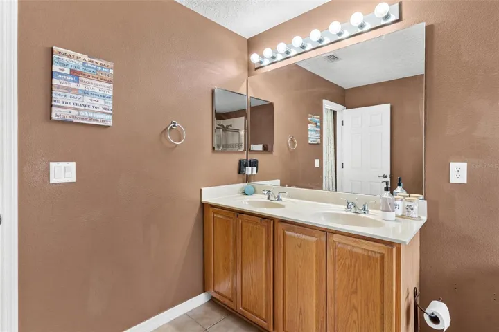 Primary Bathroom features dual vanity sinks, garden tub, and walk in shower.