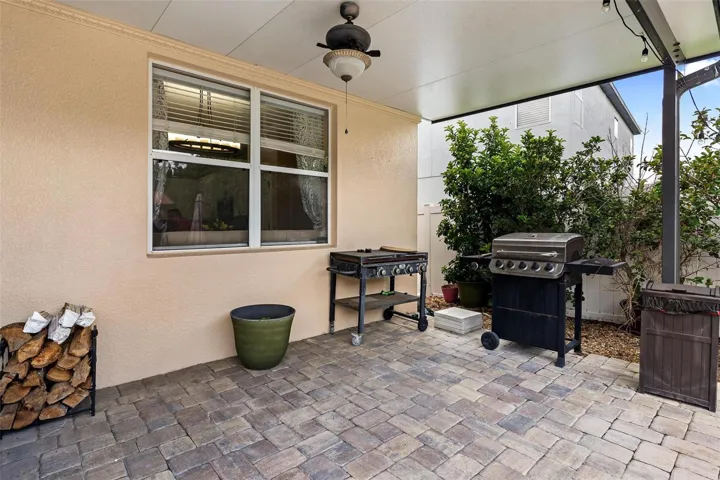 Cover patio is located just off the screened enclosed lanai and is the perfect place for grilling.