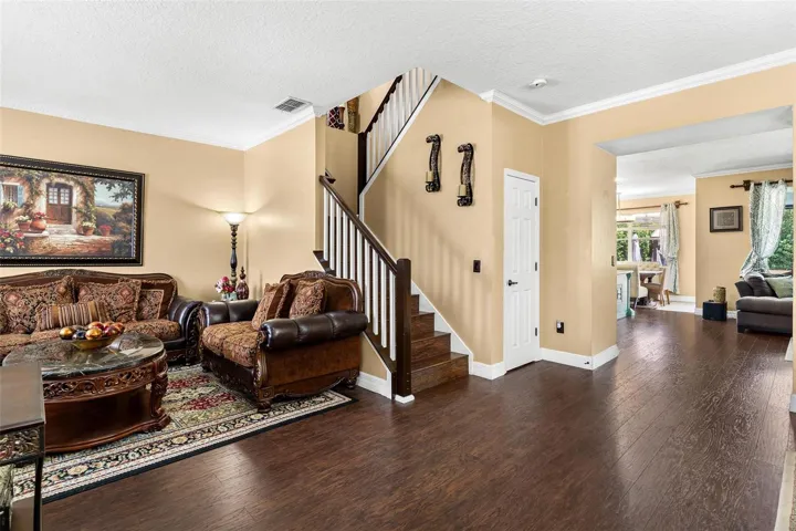 Front entry leads to formal living and dining area, laminate wood flooring and leads to kitchen