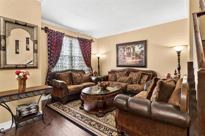 Formal Living Room features laminate wood flooring overlooks formal dining area.