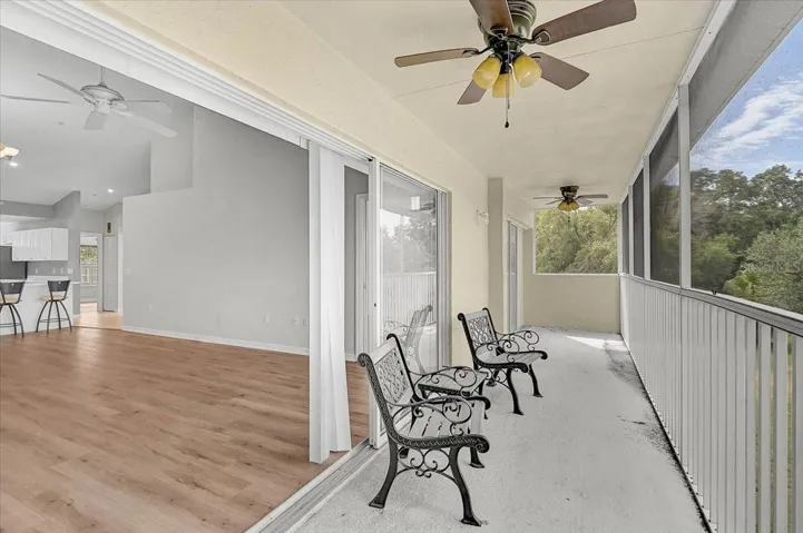 Long screened patio with 2 ceiling fans