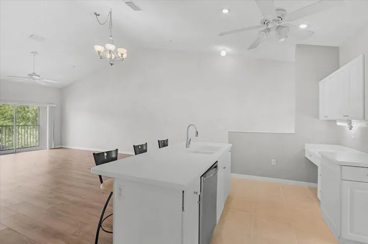 view of island and desk to the right