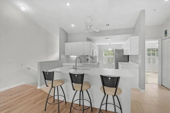 Nice bright kitchen, to the right is the hallway to the guest bedroom and bath