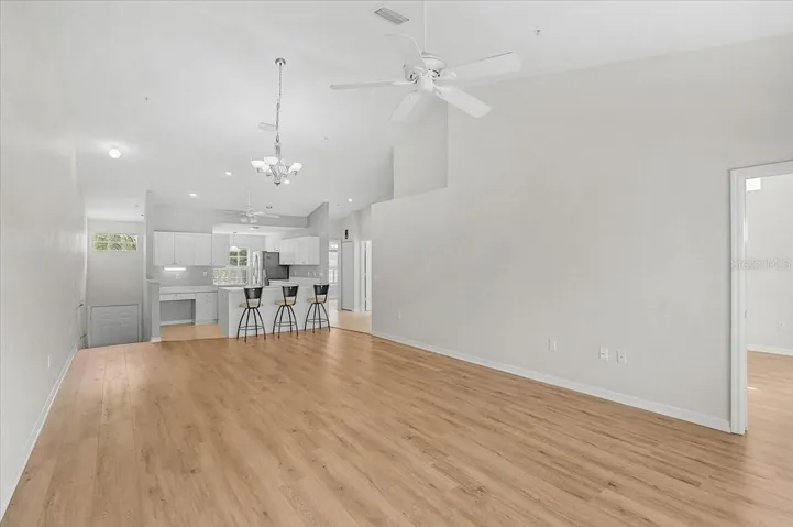Front door on the left down one flight of stairs, that lead to the entry landing as well as to the garage