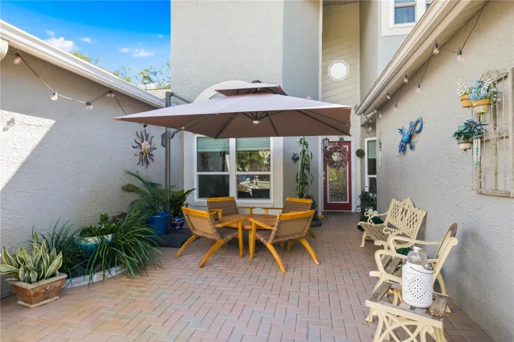 Your large inviting entry patio perfect for neighborly chats!