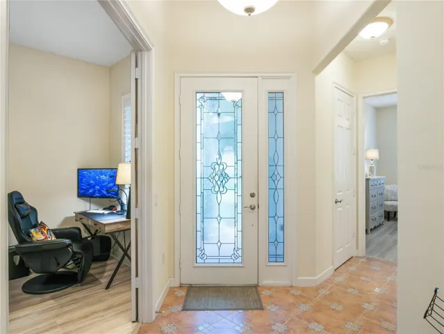 Leaded glass front door with sidelight.