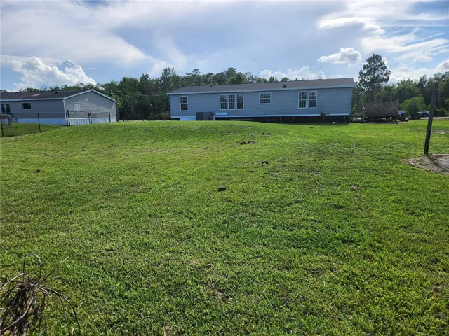 VIEW OF REAR FROM POND