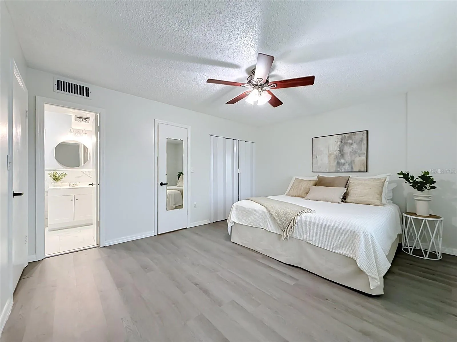 Primary Suite with Walk in and wall closet, private bath