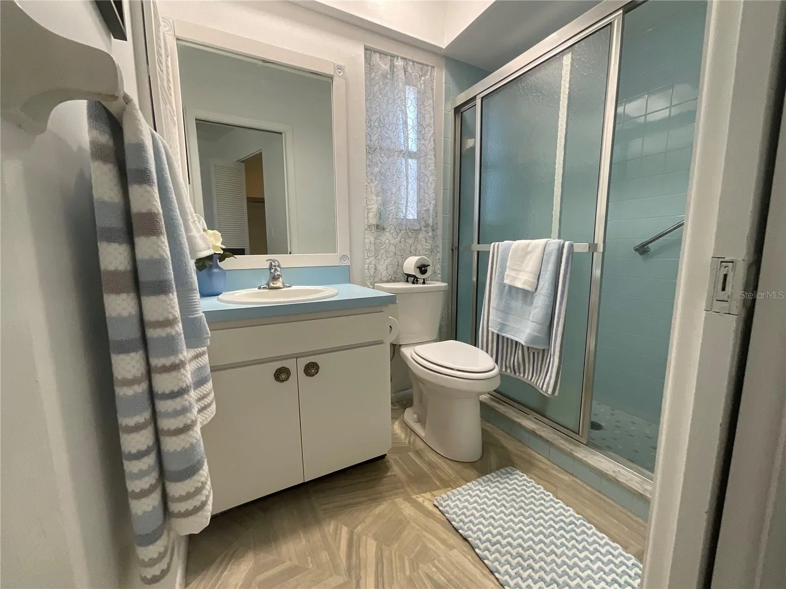 Primary bedroom's en-suite bathroom with walk-in shower