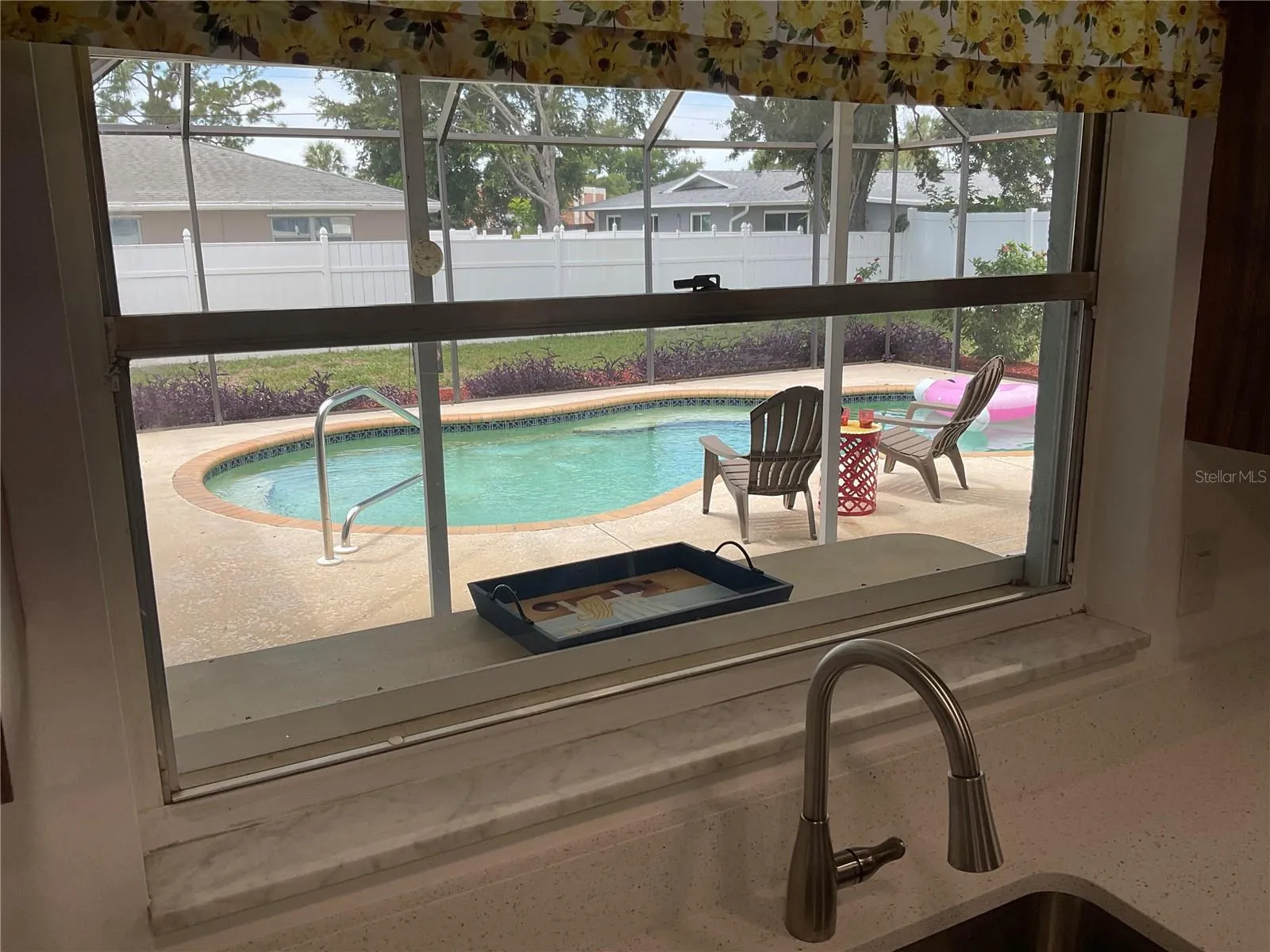 A window that opens to the pool for quick delivery of snacks and beverages!