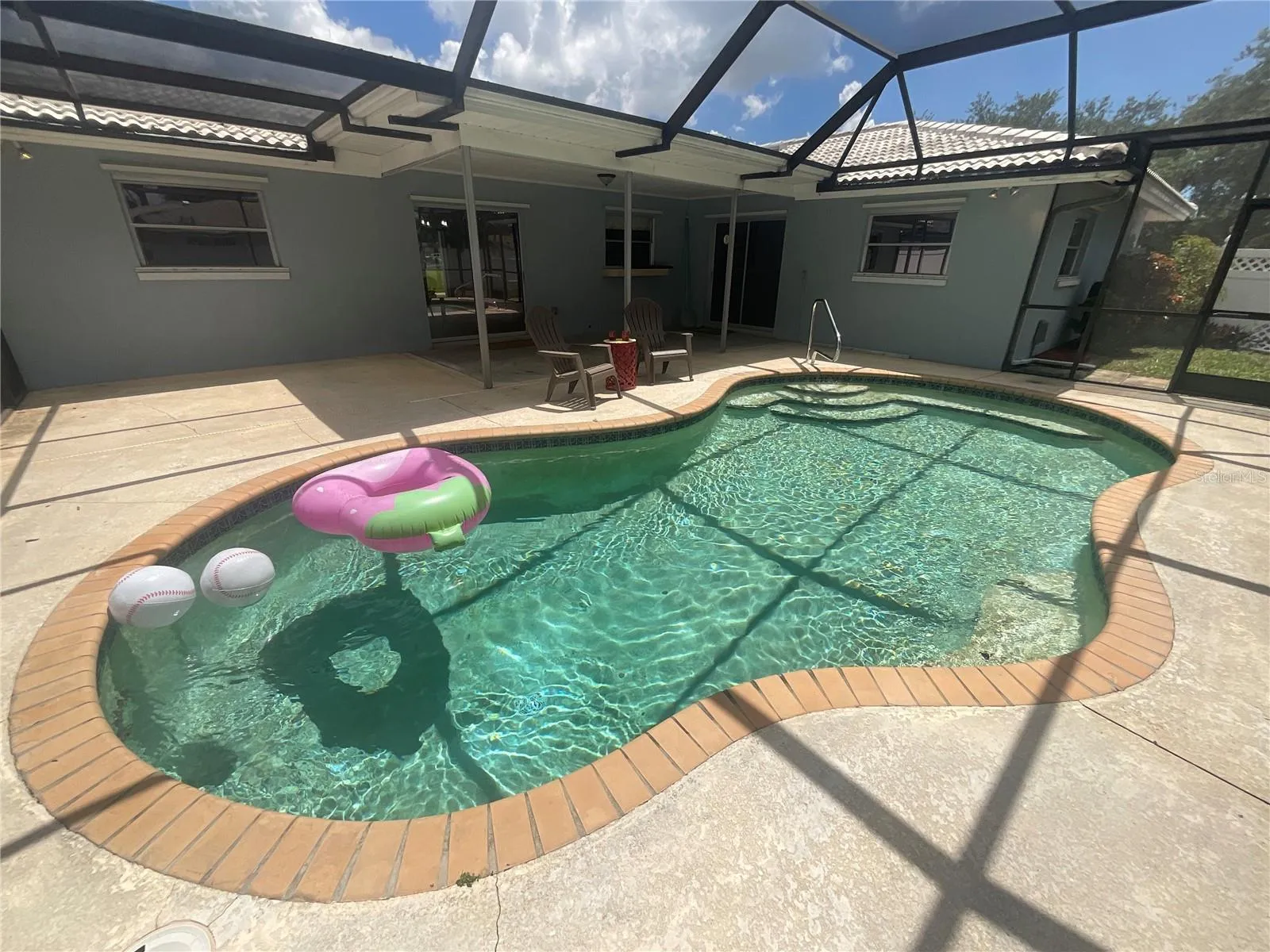 Patio deck is large to enjoy both covered and uncovered areas for your pool pleasure