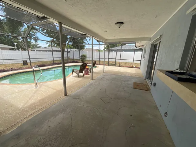 Covered patio area inside of pool cate