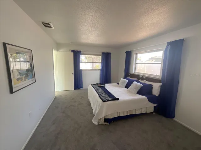 Primary Suite with plenty of natural light and plenty of room for additional furniture with a nicely sized walk-in closet too!