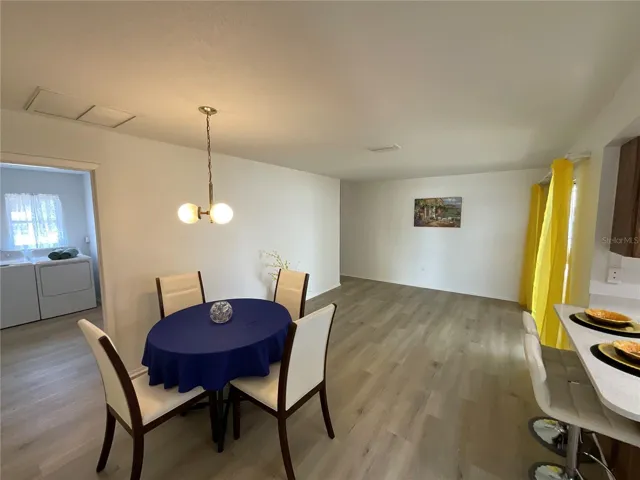 Dinette area with easy access to oversized indoor laundry room