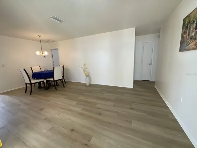 Enter through patio sliders to the dinette/family room