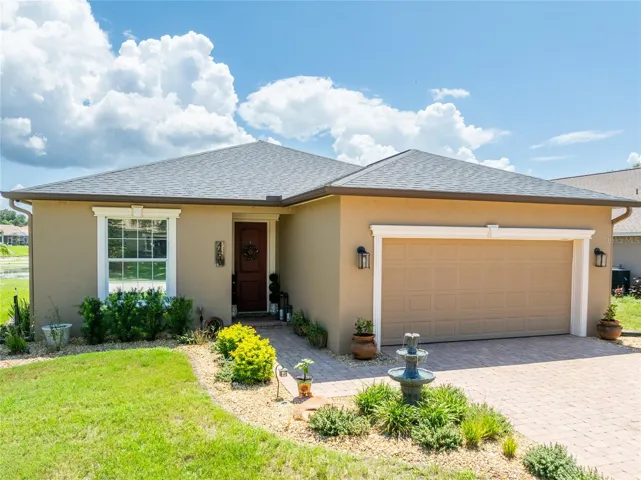 Beautifully maintained 3 bedroom, 2 bath Pool home with a pond and conservation view in the Gated Community of Fairway Oaks.