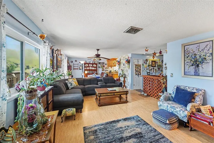 Open floor plan. The kitchen connects seamlessly to the dining and living areas.