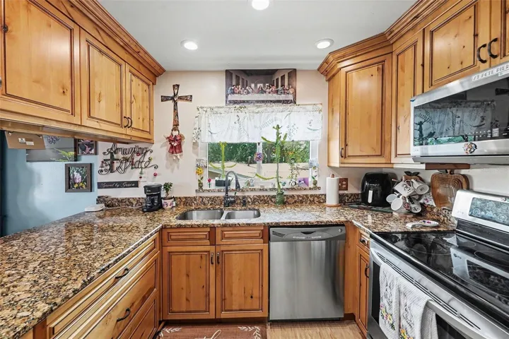 The kitchen opens seamlessly to the dining and living areas.