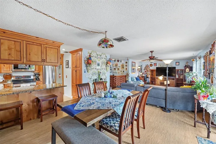 The kitchen opens seamlessly to the dining and living areas.