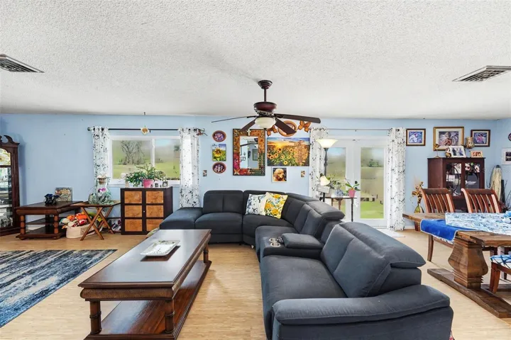 Open floor plan. The kitchen connects seamlessly to the dining and living areas. The french doors lead you to the  deck.