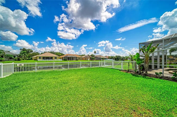 Partially fenced back yard.