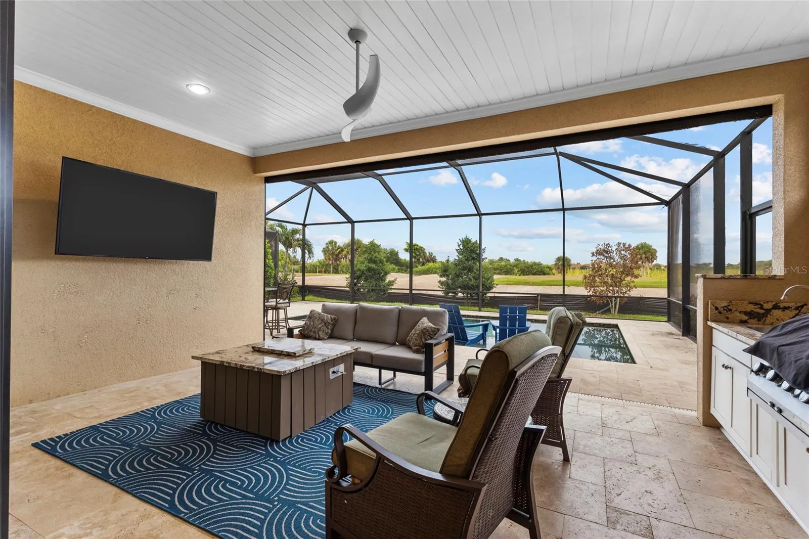 Covered Lanai with Outdoor Summer Kitchen-Built-In Grill, Sink &amp; Beverage Refrigerator.