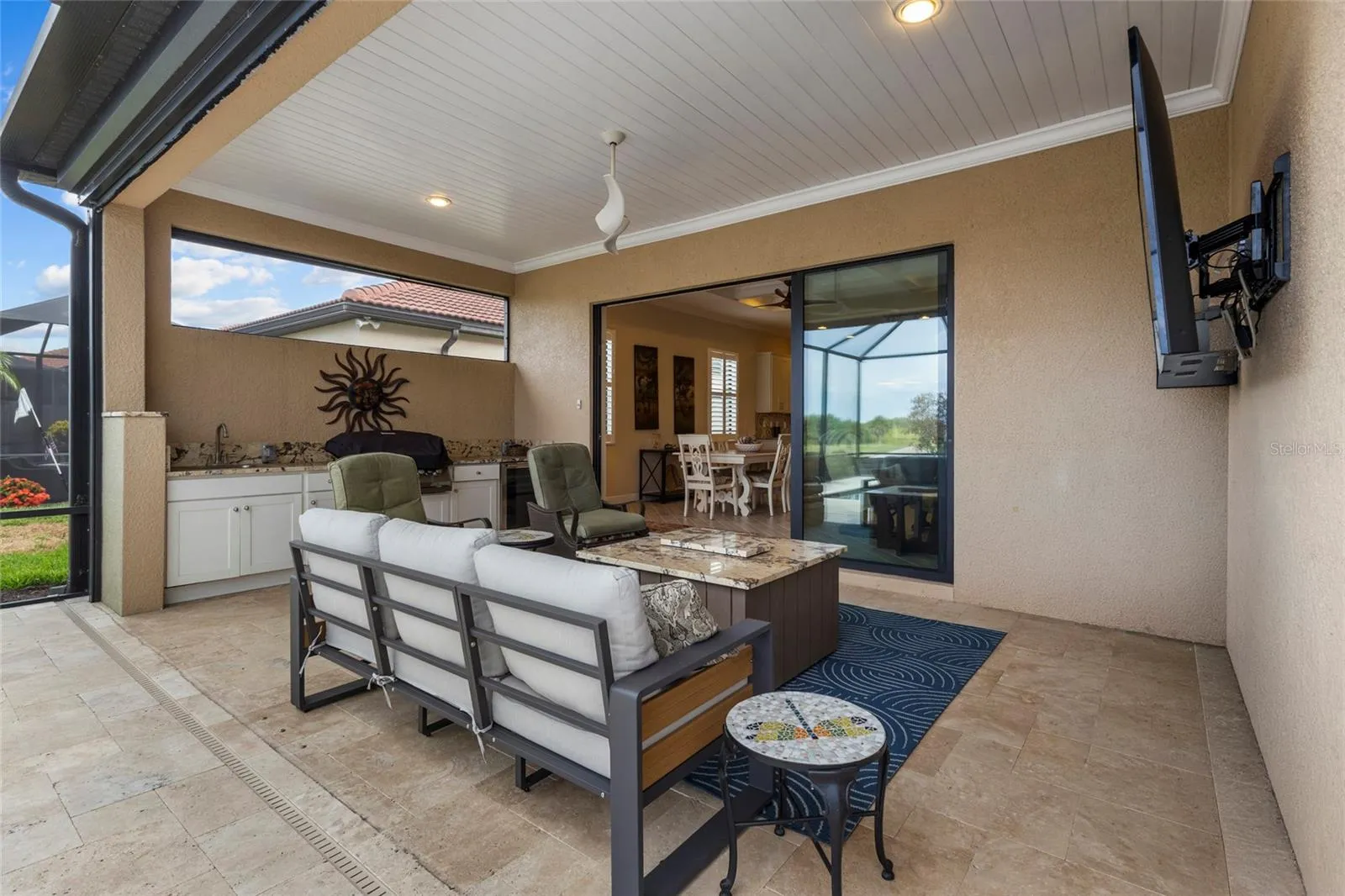 Covered Lanai with Outdoor Summer Kitchen-Built-In Grill, Sink &amp; Beverage Refrigerator.
