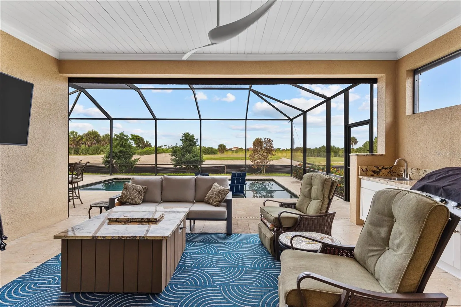 Covered Lanai with Outdoor Summer Kitchen-Built-In Grill, Sink &amp; Beverage Refrigerator.
