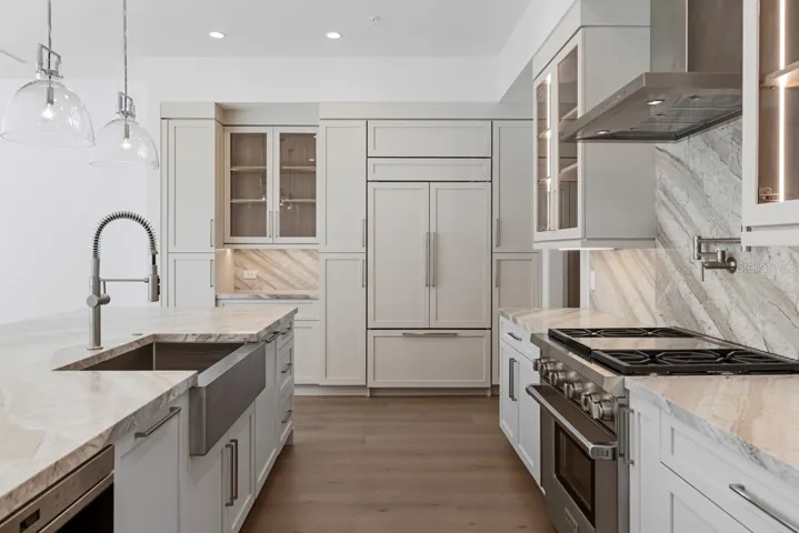 Gourmet kitchen with frameless contemporary cabinetry and alarge prep island