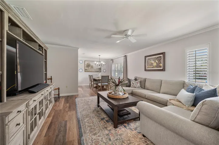 The formal living space flows seamlessly into the formal dining room perfect for entertaining. Plantation shutters adorn all of the windows in this home.
