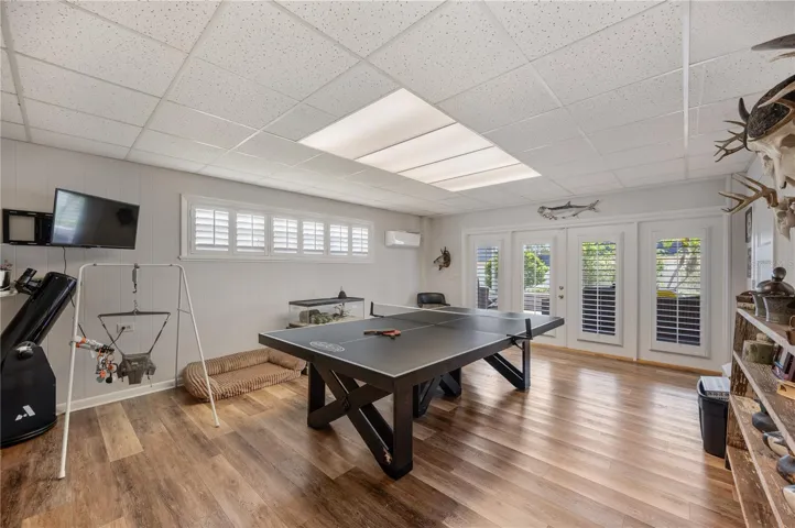 The game room is huge, with its very own newer Mini split AC. This room also has french doors that lead to a very large screened covered rear patio.