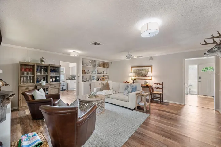 The family room featuring the flow into the kitchen and foyer