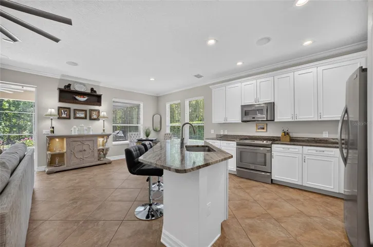 Beautiful Kitchen with remodeled striking granite counters, all kitchen appliances included and white cabinets.