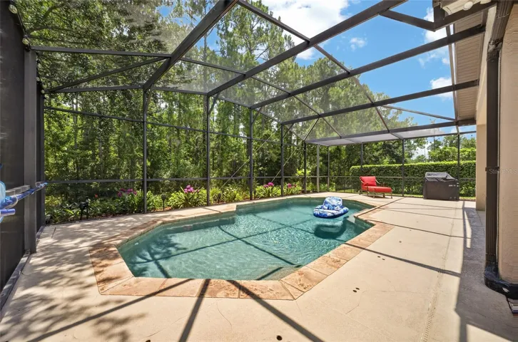 Amazing outdoor living space with stamped crete around the pool and patio area, covered patio and screened lanai with outstanding conservation views
