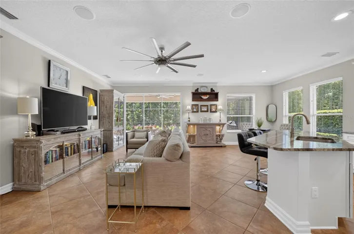 Family room with sliding glass doors to the outstanding pool area.