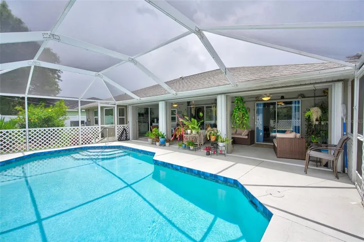 large pool with sun shelf in deep end