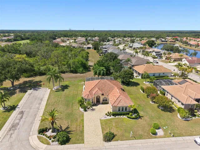 Aerial, Newer Tile Roof, Large Corner Lot, Paved Driveway, Oversized 2+ Car Garage
